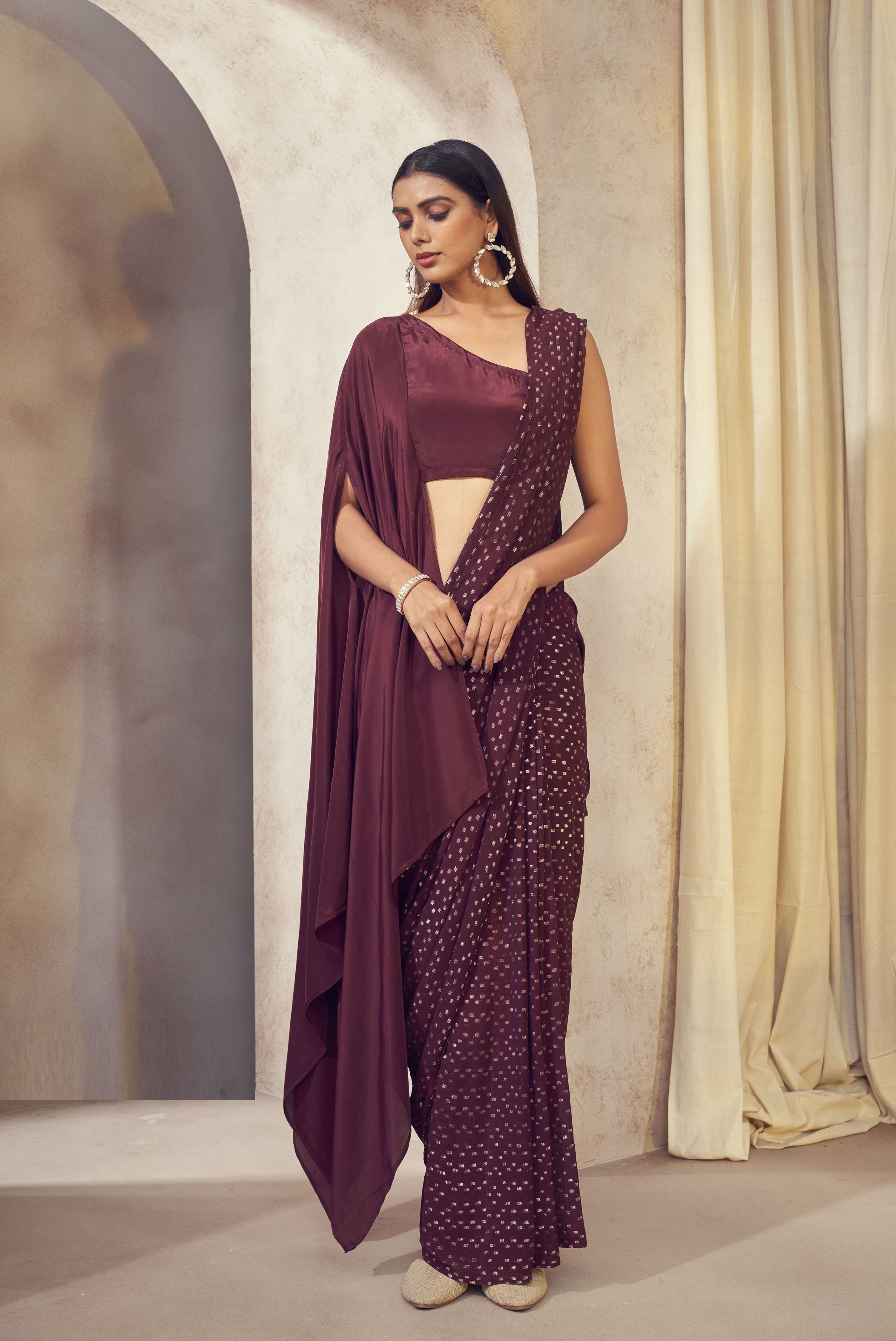 Sitaara wine saree with asymmetrical cape blouse