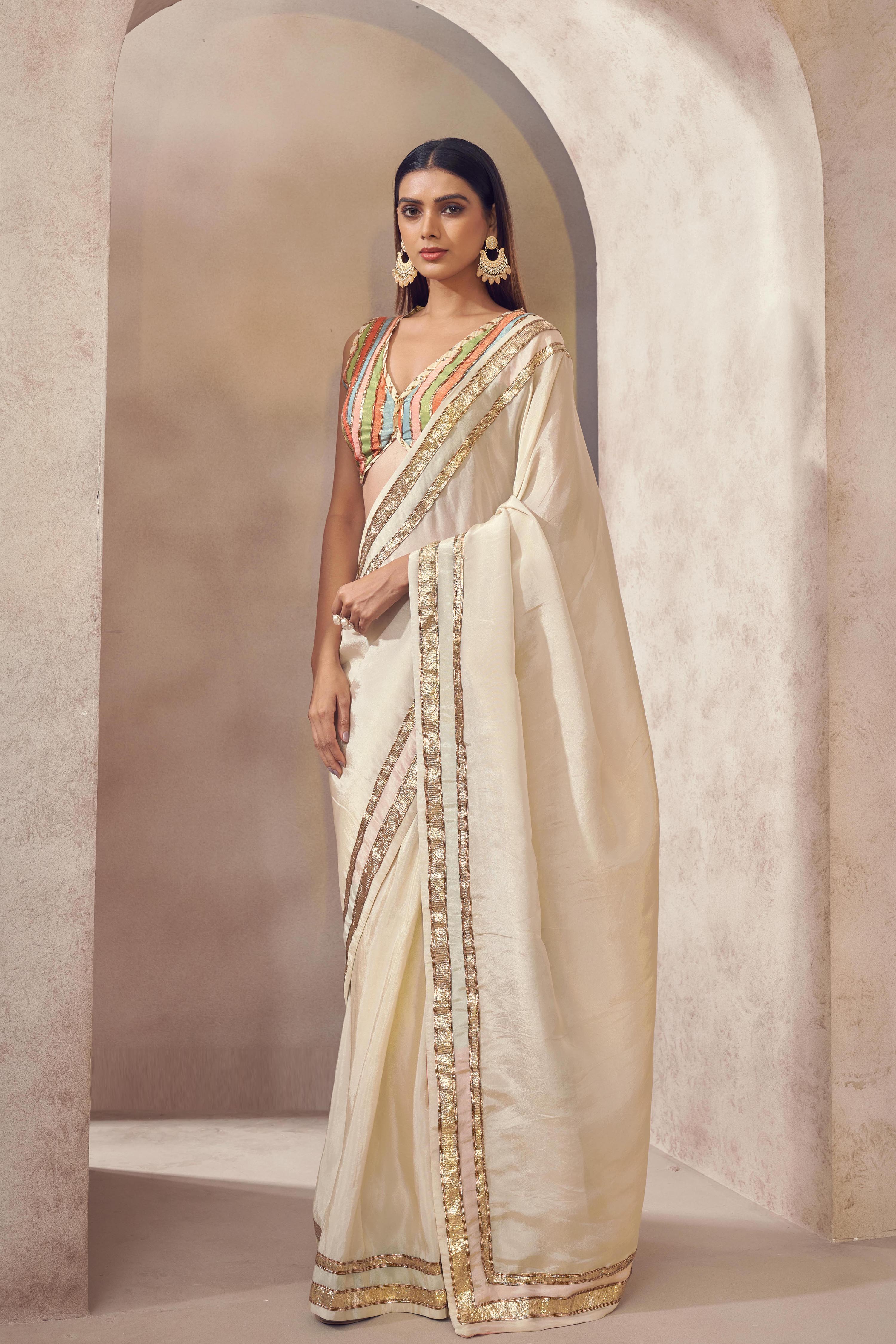 Sunehri Tissue silk saree with multicolored blouse