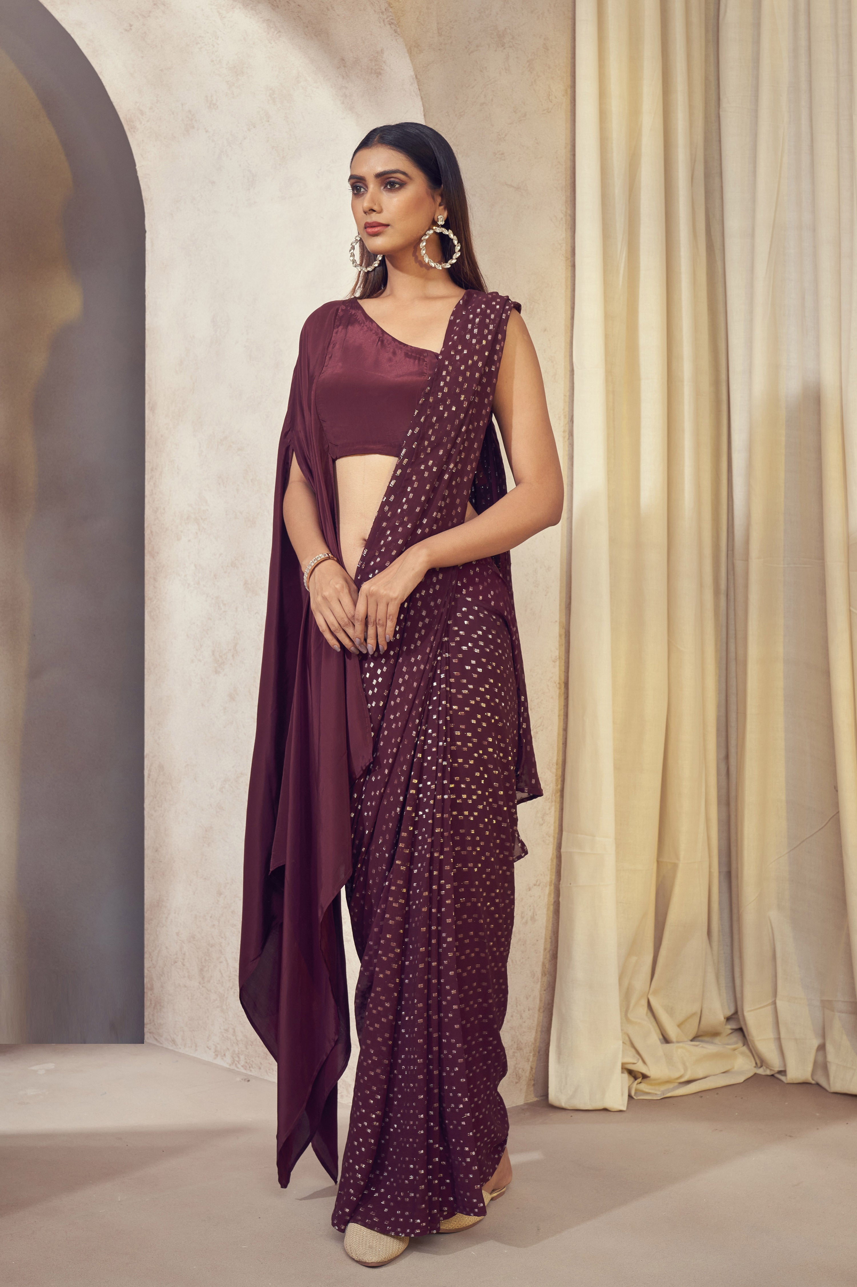 Sitaara wine saree with asymmetrical cape blouse