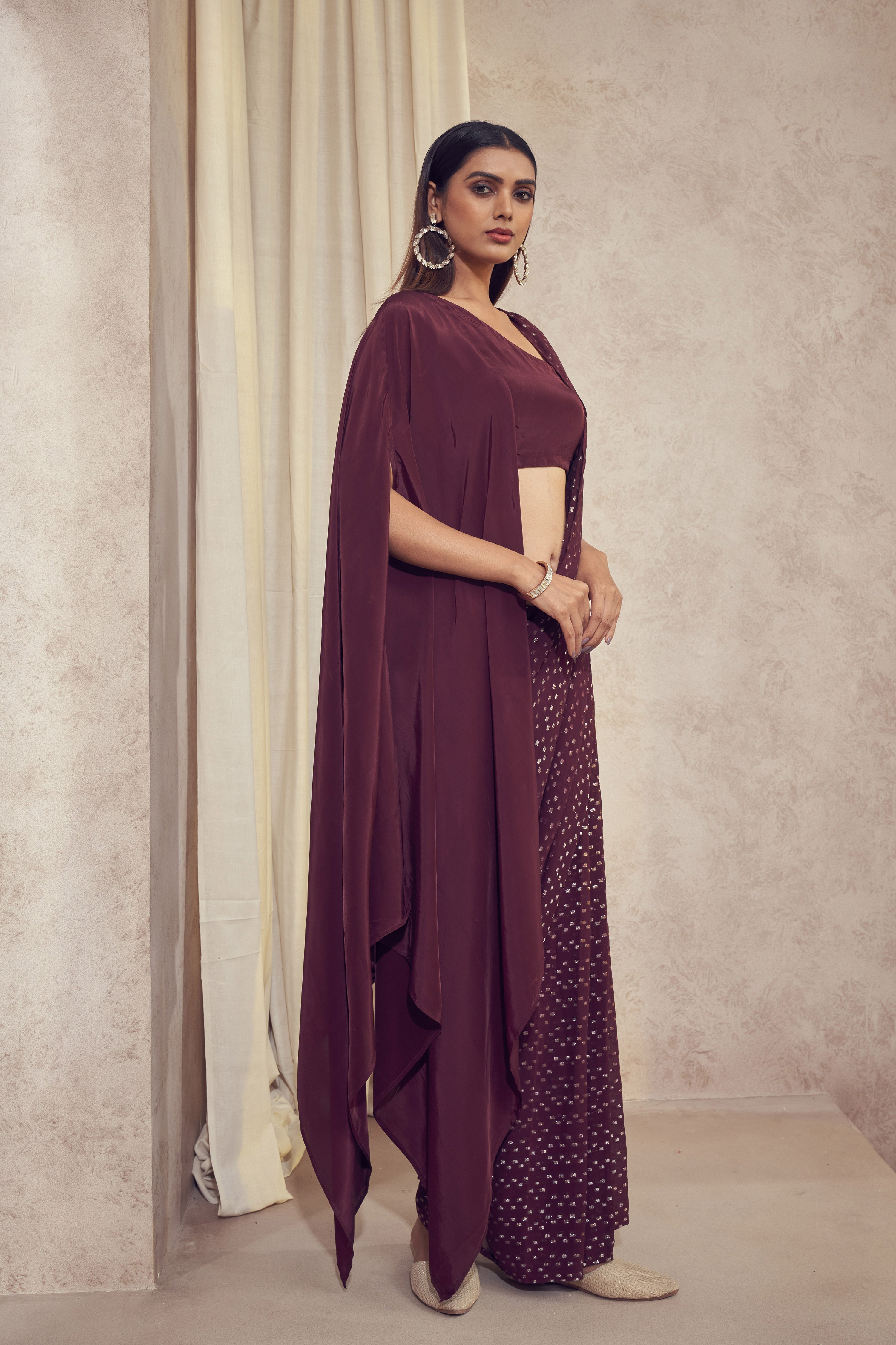 Sitaara wine saree with asymmetrical cape blouse